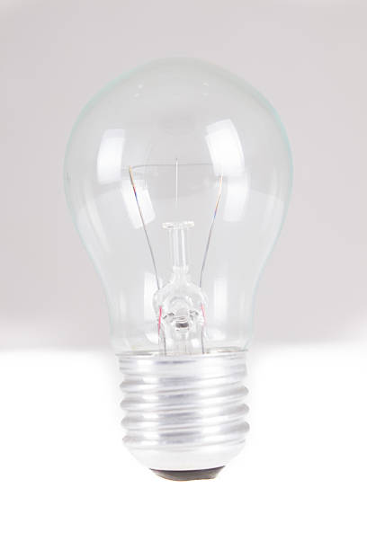 istock Clear light bulb with filament showing 451251597