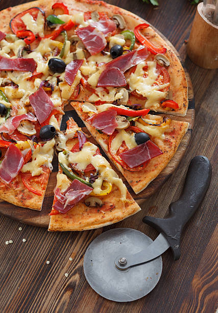 istock Pizza with hum, cheese, tomato and pepper 451252587