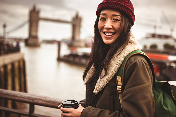 istock chinese tourist smiling in London 451256743