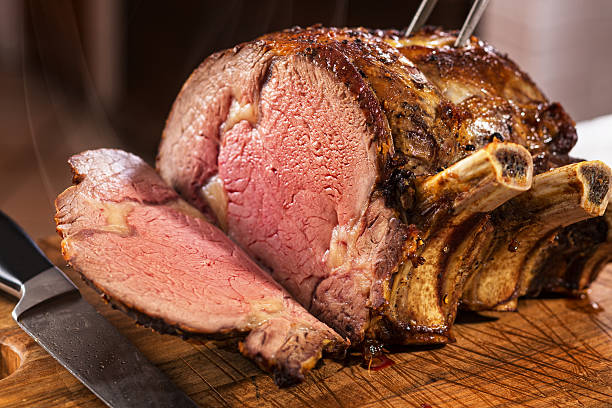Prime Rib Roast Prime rib roast on cutting board. roast dinner photos stock pictures, royalty-free photos & images