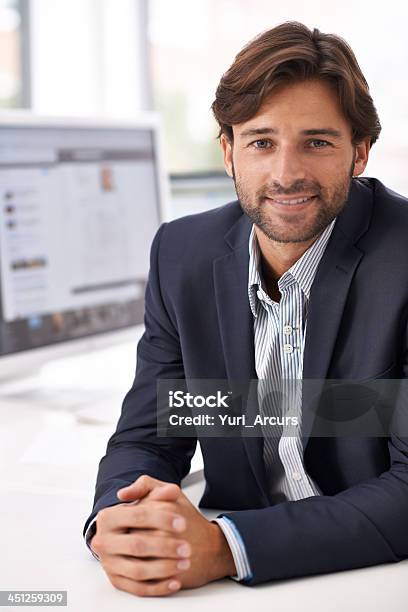 Using My Charm In And Around The Office Stock Photo - Download Image Now - Cheerful, Men, Suit