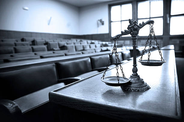 Decorative Scales of Justice in the Courtroom Symbol of law and justice in the empty courtroom, law and justice concept, blue tone legal trial stock pictures, royalty-free photos & images