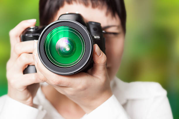 istock Woman photographer with camera 451273653