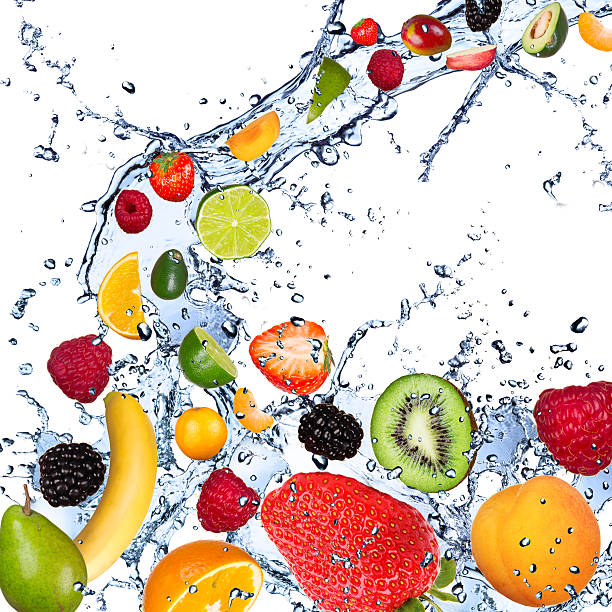 istock Variety of tropical fruits falling with water 451274285