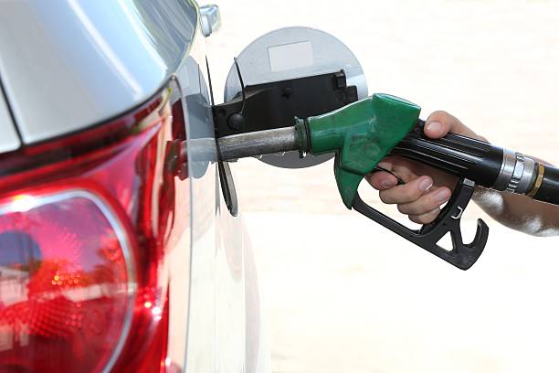 istock Gas Station Refill Hand and Nozzle 451275327