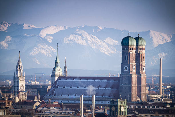 Munich in Winter Munich covered in snow in front of the Bavarian Alps. munich cathedral photos stock pictures, royalty-free photos & images