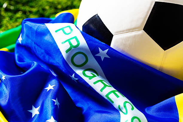 istock Brazilian flag with soccer ball on grass 451289291