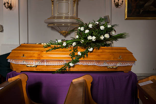 istock Flowers on a coffin - church 451290895