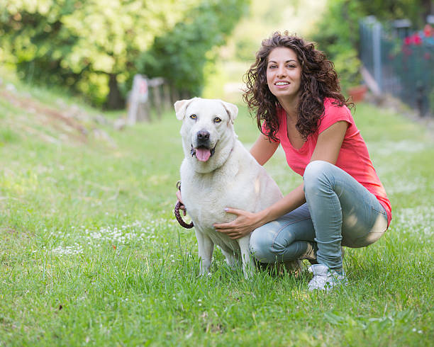 istock Young Woman with Dog 451295807