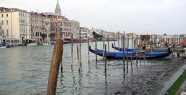 istock Italian Gondolas Venice docked along side of old buildings 451296675
