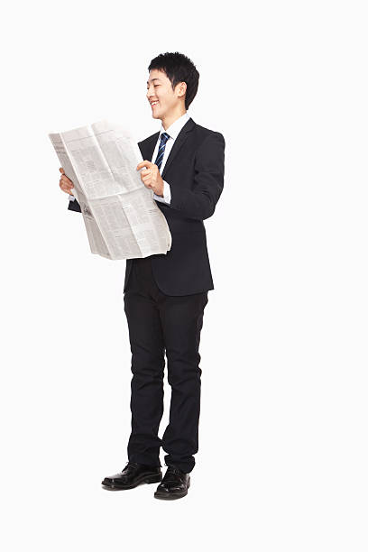 istock Businessman reading newspaper 451296707