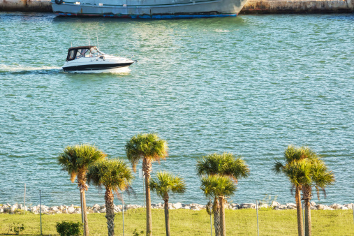 A small motor boat is cruising in the harbor in Port Canaveral, Florida  RM