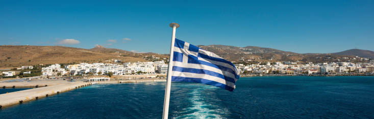 Flag on a ferry cruising the Greek Islands