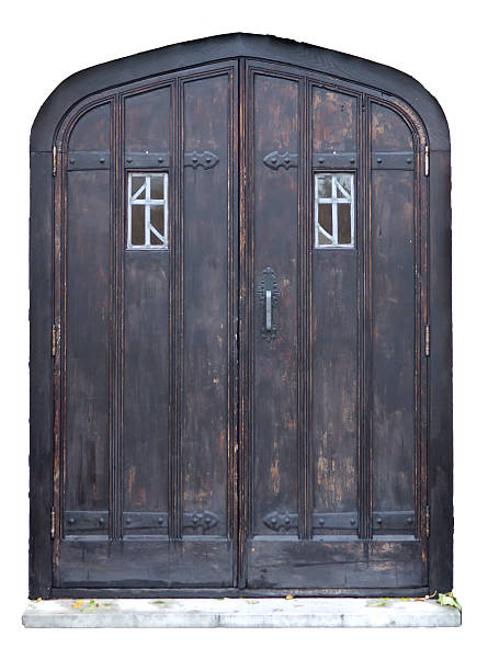 Closed ancient wooden gate of old farm house with handle. Beautiful weathered wood background.