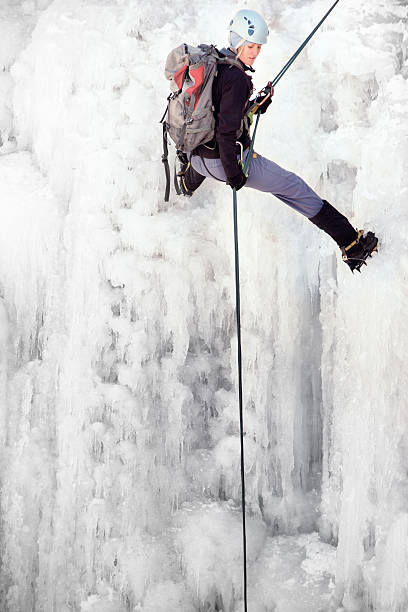 istock Young Woman Ice Climbing 451329011