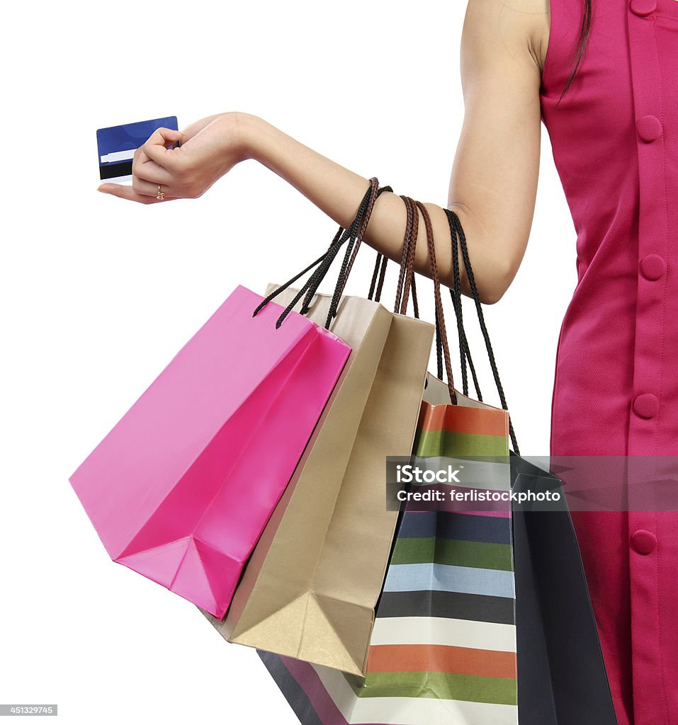 Shopping time Close up woman hand with many shopping bags and credit card Shopping Bag Stock Photo