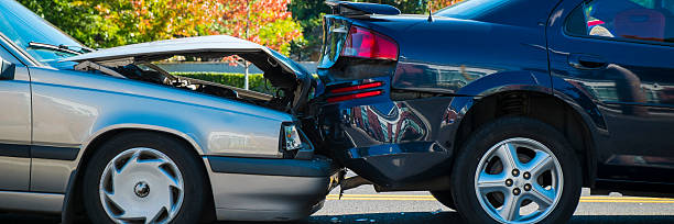 Rear end accident between two cars Auto accident involving two cars on a city street traffic accident photos stock pictures, royalty-free photos & images