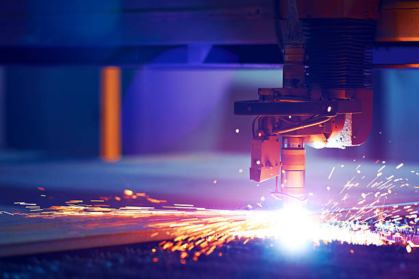 Cutting metal by plasma laser Metal cutting by flame in heavy industry. Artistic reflections and sparkles like a sun laser cutting metal stock pictures, royalty-free photos & images