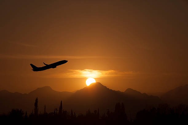 istock Airplane take of in sunset 451334375