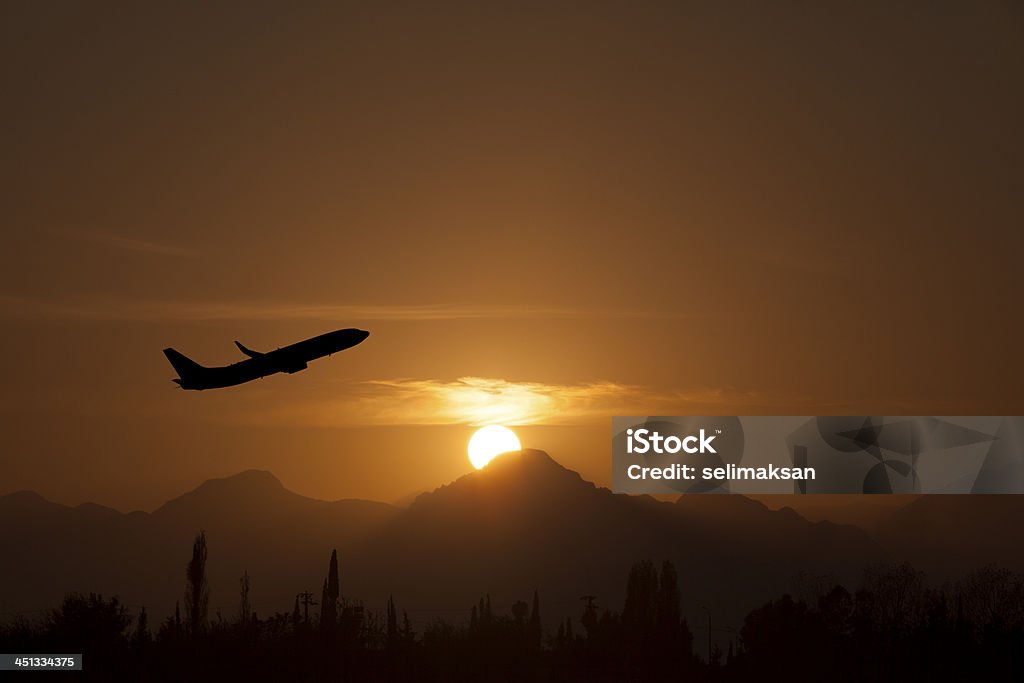 Airplane take of in sunset Activity Stock Photo