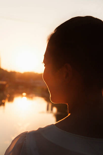 istock Silhouette of Woman's Face at Sunset 451342419