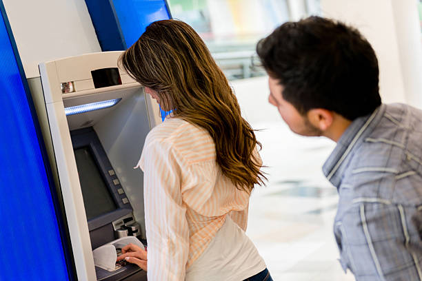 istock Man trying to see her PIN entry 451344895