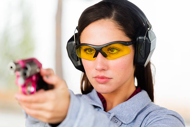 istock Young Women at the Shooting Range 451346095