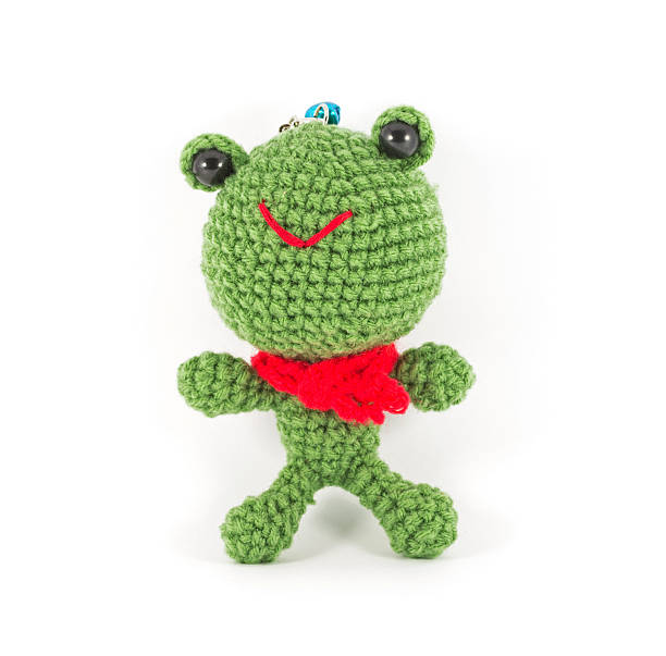 istock handmade crochet green frog doll on white background 451347767
