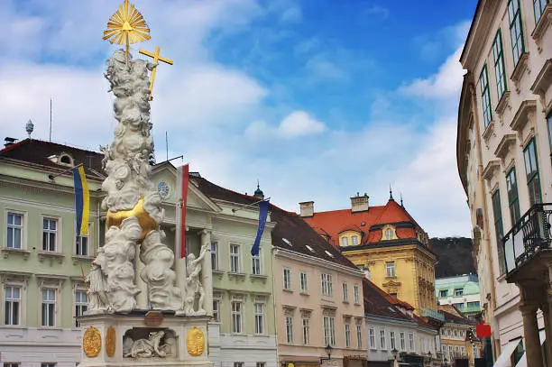 Plague column and the main street in a small town of Baden, Austria