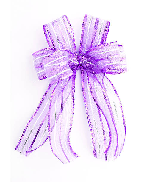 istock Purple Satin gift bow. ribbon isolated on white 451352585
