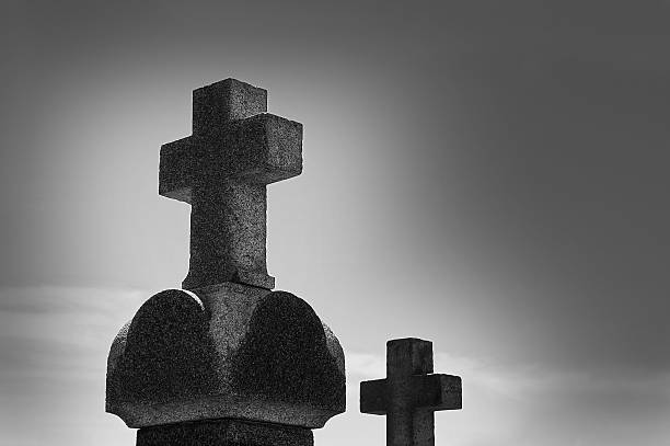 istock Cross in fog at the cemetery 451352727