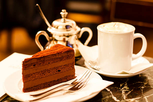 Chocolate cake in Demel café, Vienna Piece of chocolate cake with almond coffee in Demel cafe, Vienna, Austria austrian culture photos stock pictures, royalty-free photos & images