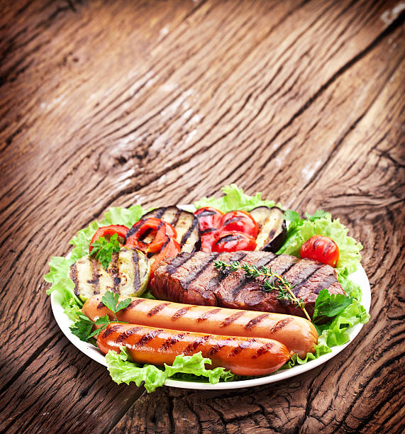 istock Grilled steak,sausages and vegetables. 451359713