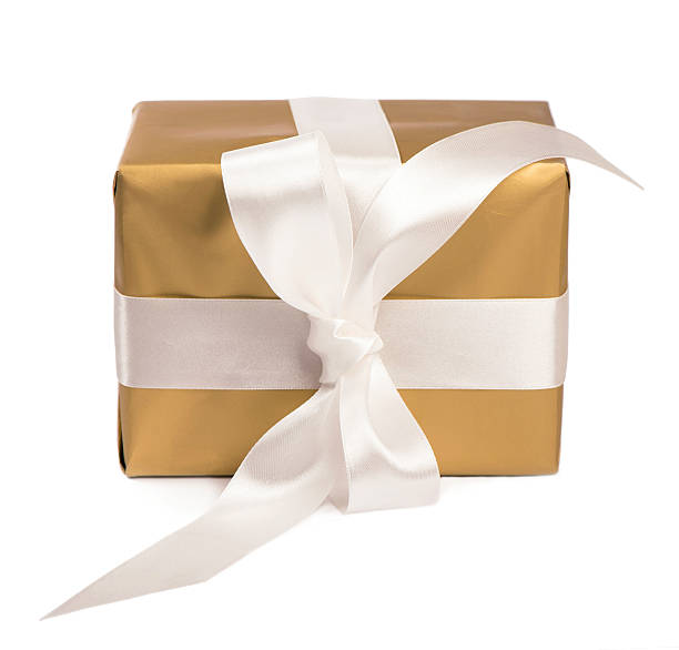 istock gift packed into golden box with White Ribbon 451365569
