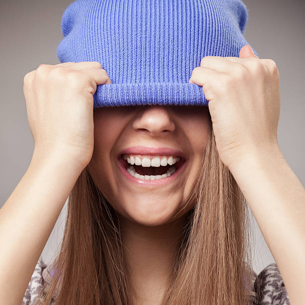 istock Girl holding cap and smile 451393731
