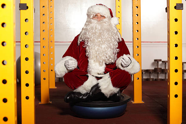 istock Santa Claus sitting in yoga position 451393901