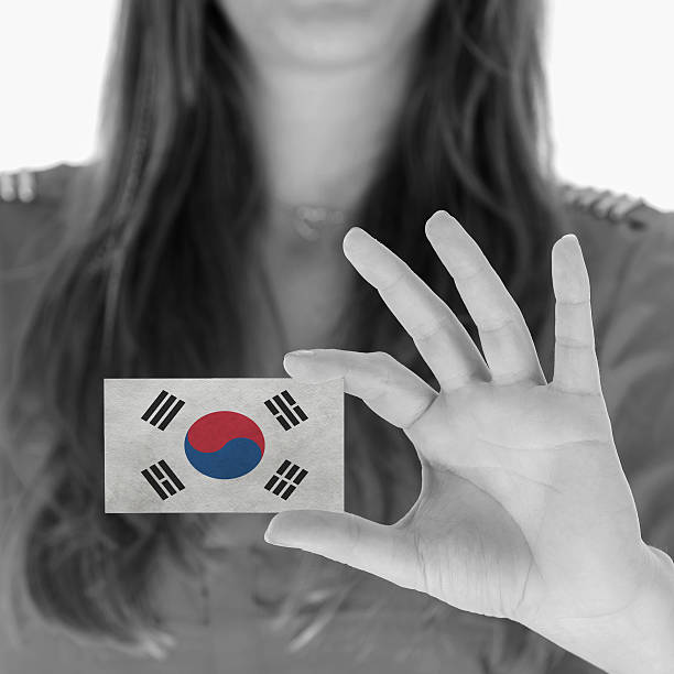 istock Woman showing a business card 451414707