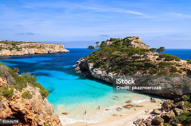 Young Couple Playing In Water At Beautiful Beach Stock Photo - Download Image Now - Majorca, Beach, Balearic Islands