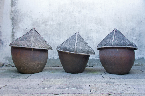Covered pots for making soy sauce and fish sauce in a traditional chinese way.