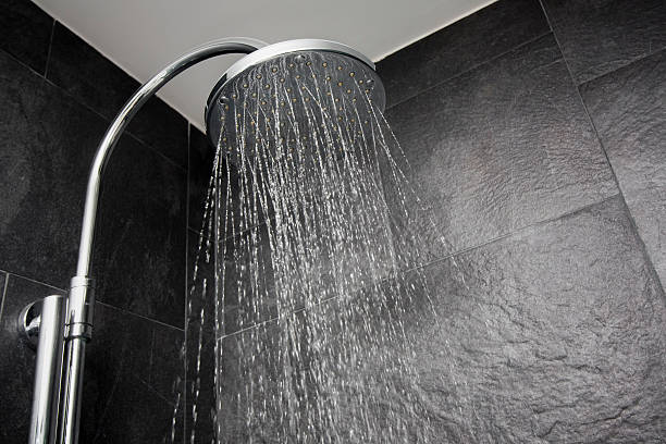 istock Big shower head sprinkling water 451419567