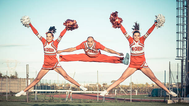 istock Group of Cheerleaders in the Field 451429075