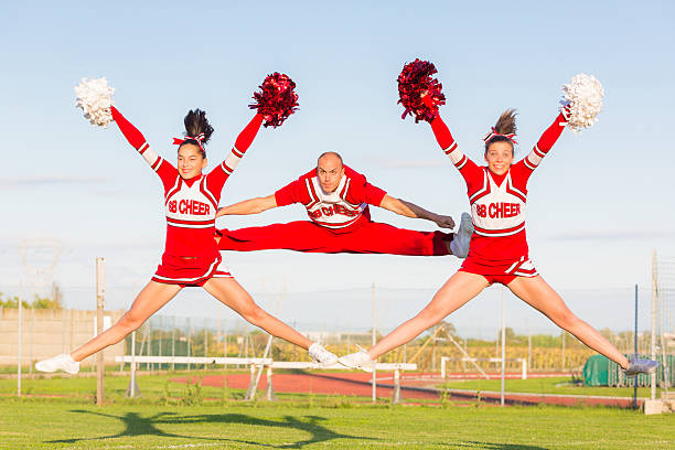 istock Group of Cheerleaders in the Field 451429201
