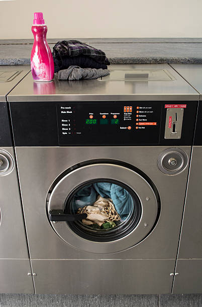 Coin Op Laundry Washing Machine Dryer With Quarters Stock Photo - Download  Image Now - iStock