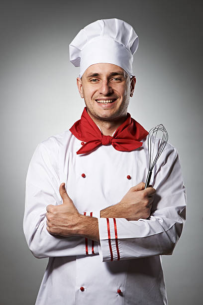 istock Male chef with thumb up portrait 451521235