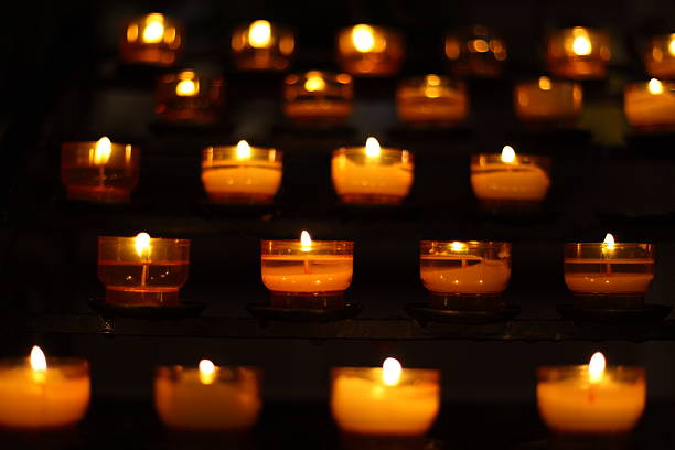 istock burning candles in church 451530921