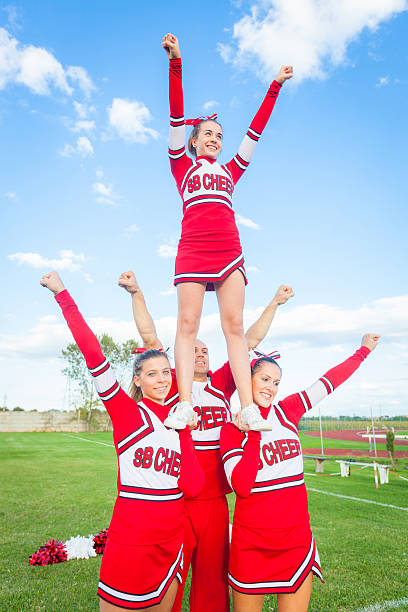 istock Group of Cheerleaders in the Field 451532751
