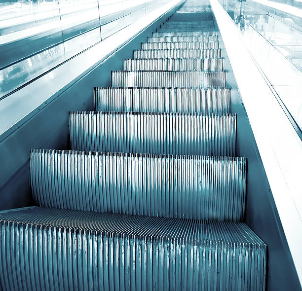 istock motion of vanishing escalator 451539631