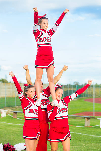 istock Group of Cheerleaders in the Field 451540241