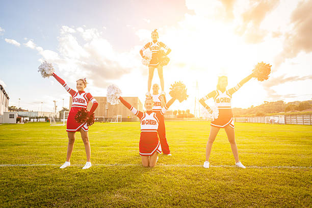 istock Group of Cheerleaders in the Field 451557965