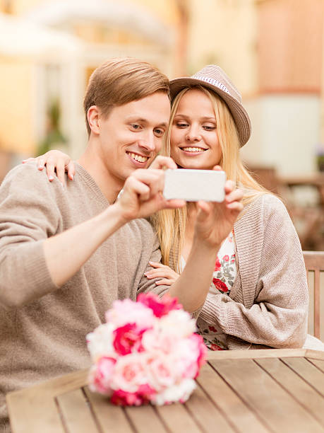 istock couple taking picture with smartphone 451558269